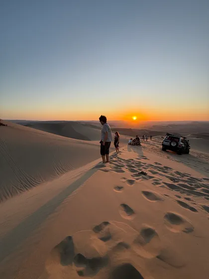 Watching the sun go down from the high dune