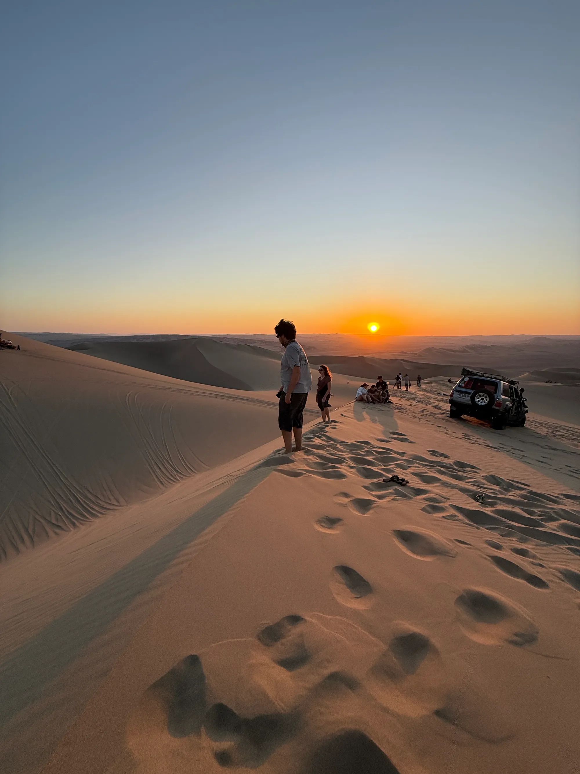 Watching the sun go down from the high dune