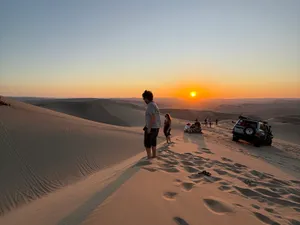 Watching the sun go down from the high dune