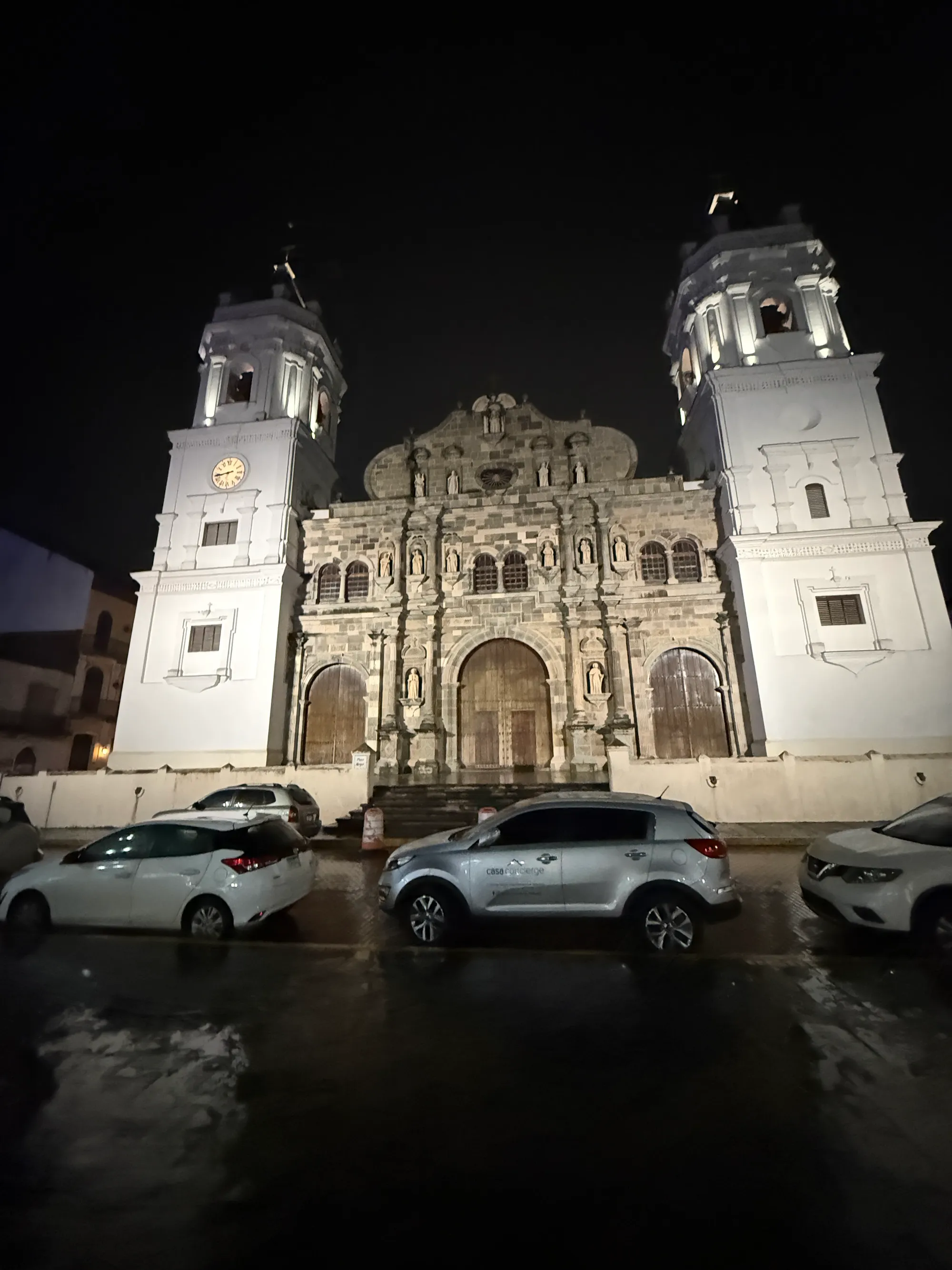 The cathedral, wet street, late