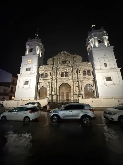 The cathedral, wet street, late