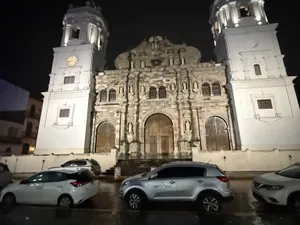 The cathedral, wet street, late