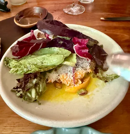 Peach and radicchio salad with aged cheese and pistachios