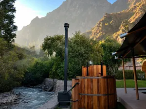 Wood-fired tubs beside the river
