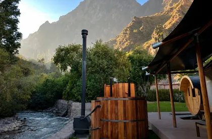 Wood-fired tubs beside the river