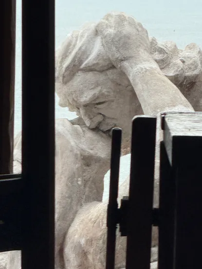 Version of the kiss as seen through the window of his apartment